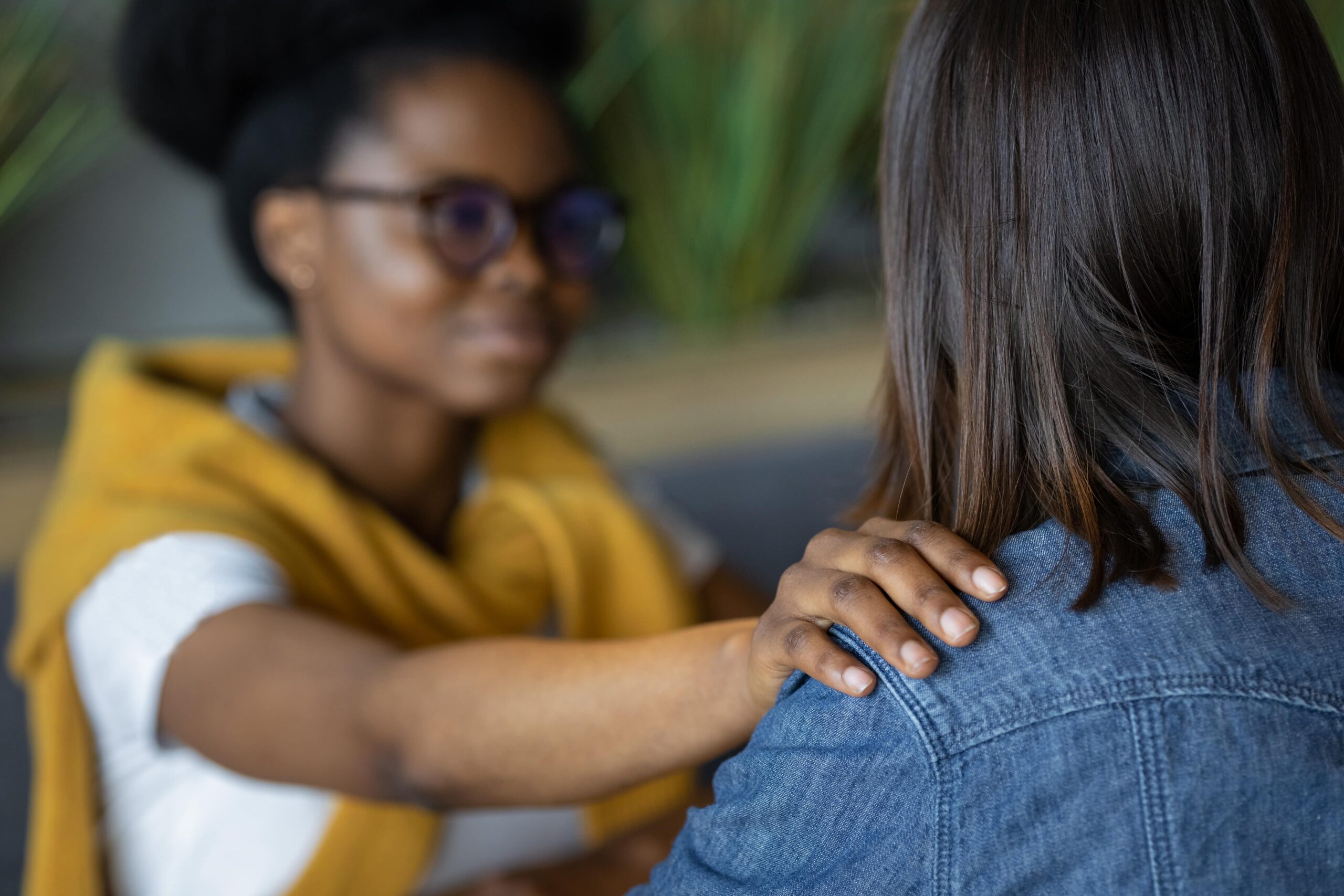 African American woman psychologist supports her patient scaled.jpg