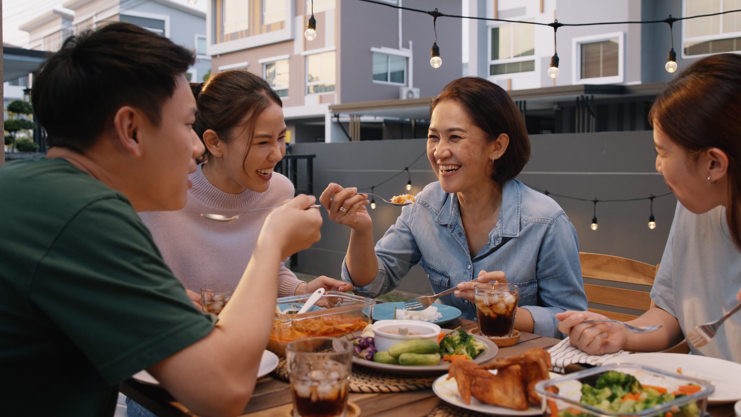 group of friends enjoying a sober holiday meal and celebrating together