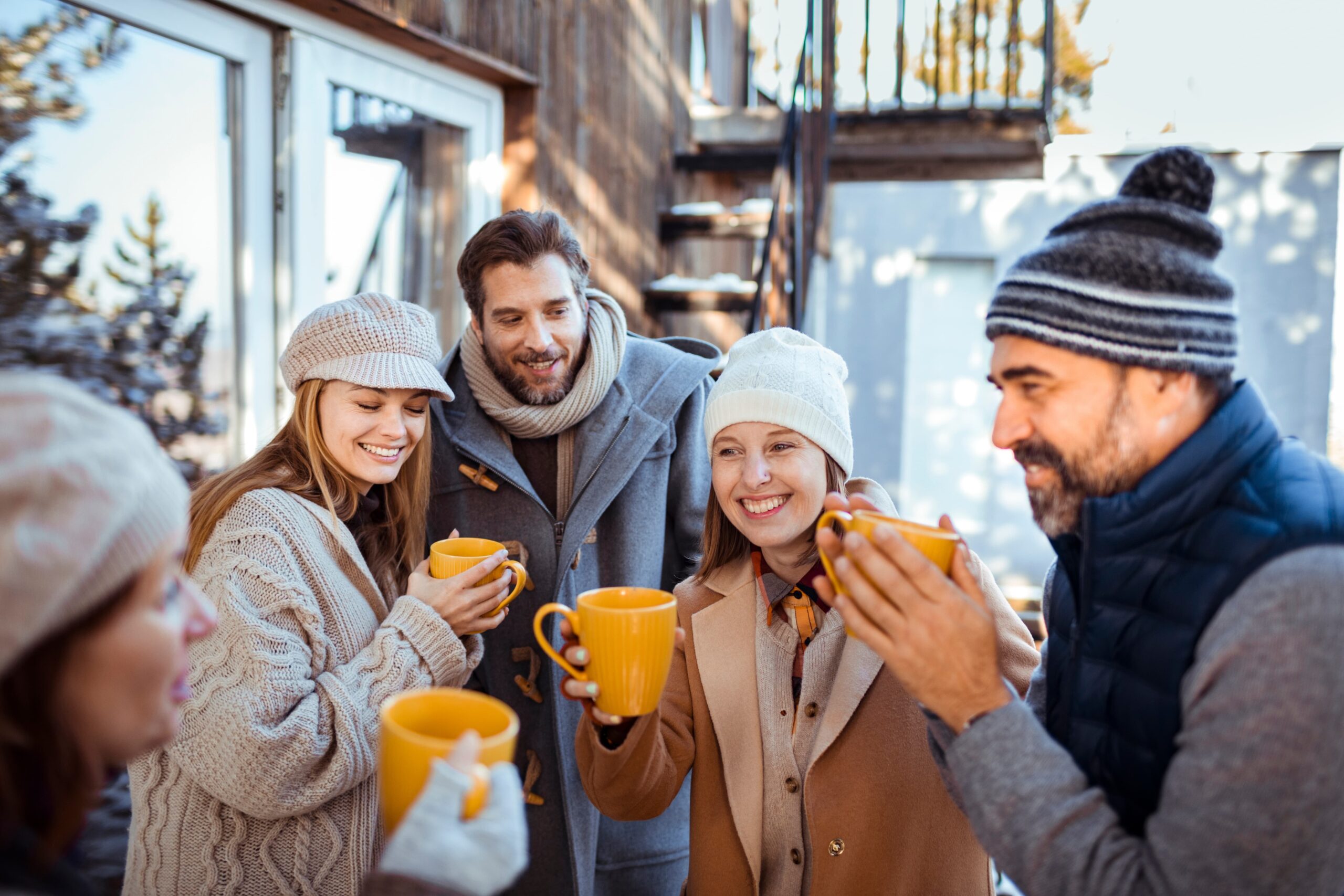 Group of friends enjoying a winter walk and hot cocoa as a sober tradition Group of friends enjoying a winter walk and hot cocoa as a sober tradition