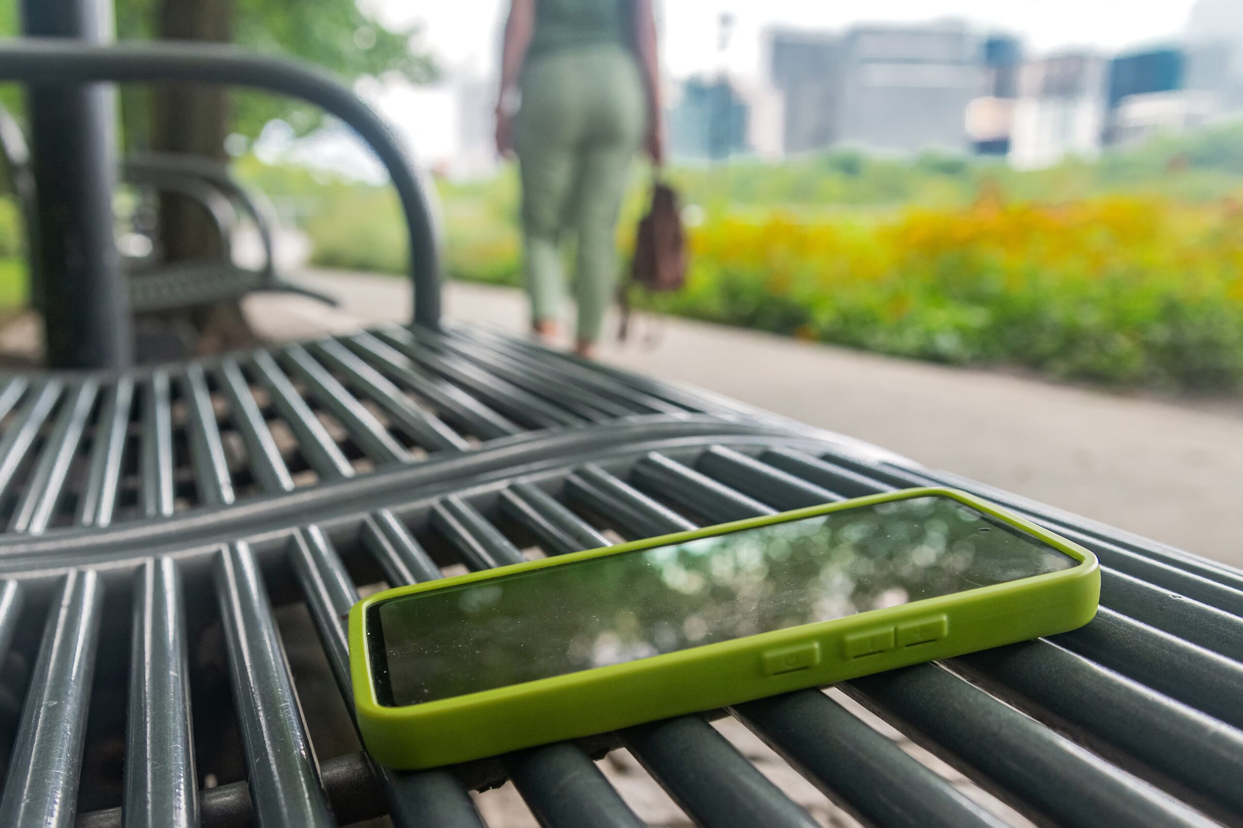 Person journaling outdoors while taking a break from technology during recovery