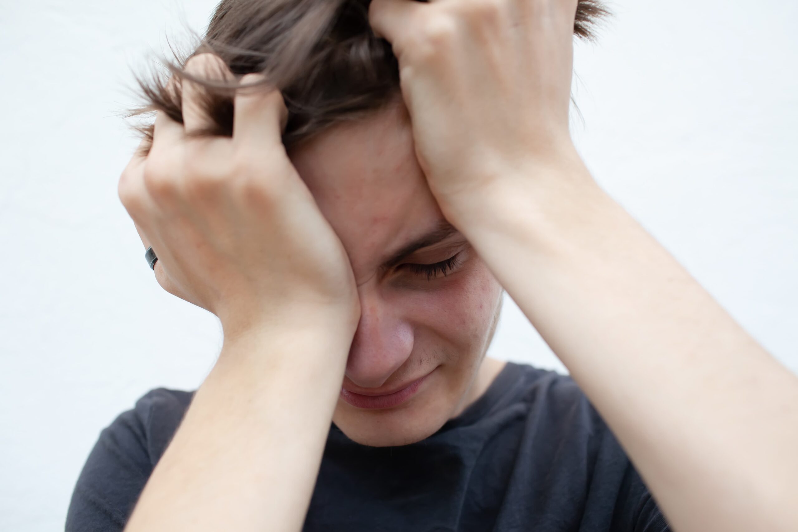 A person showing the emotional struggle linked to ADHD and Drug Abuse